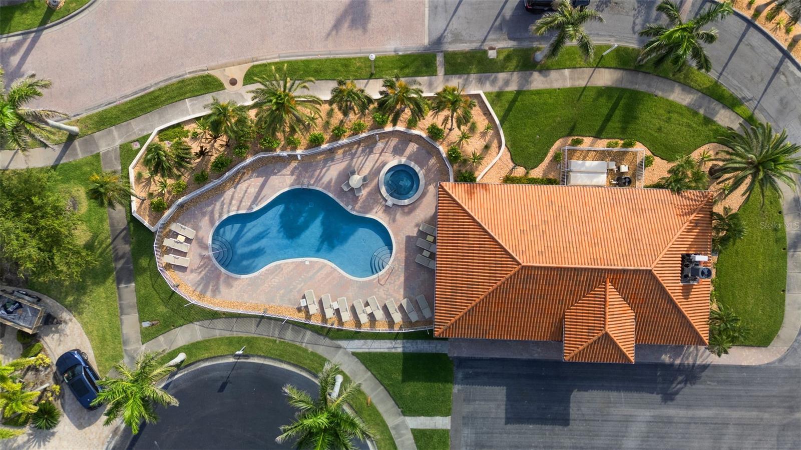 Community clubhouse at entry, property manager on site office, entertaining area, kitchen, bathrooms, FITNESS center, pool & spa  newly renovated 2026