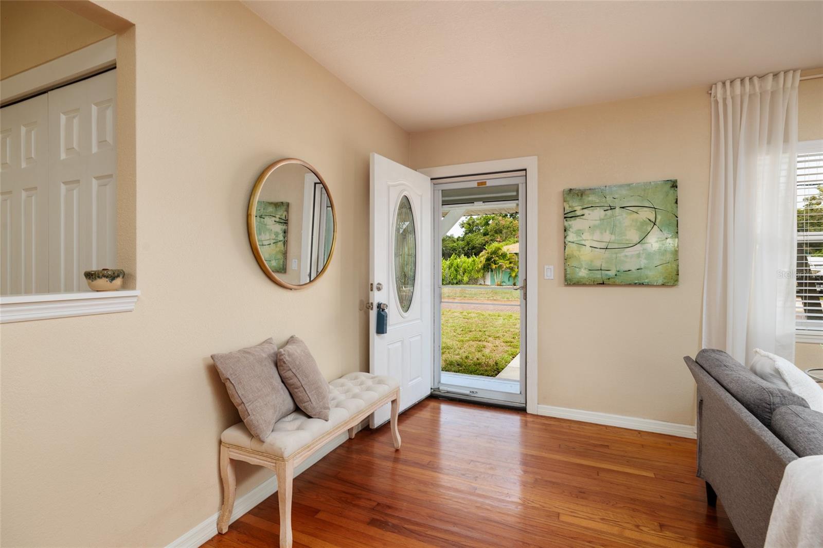 Natural light bathes this home and shows off gleaming hardwood floors!