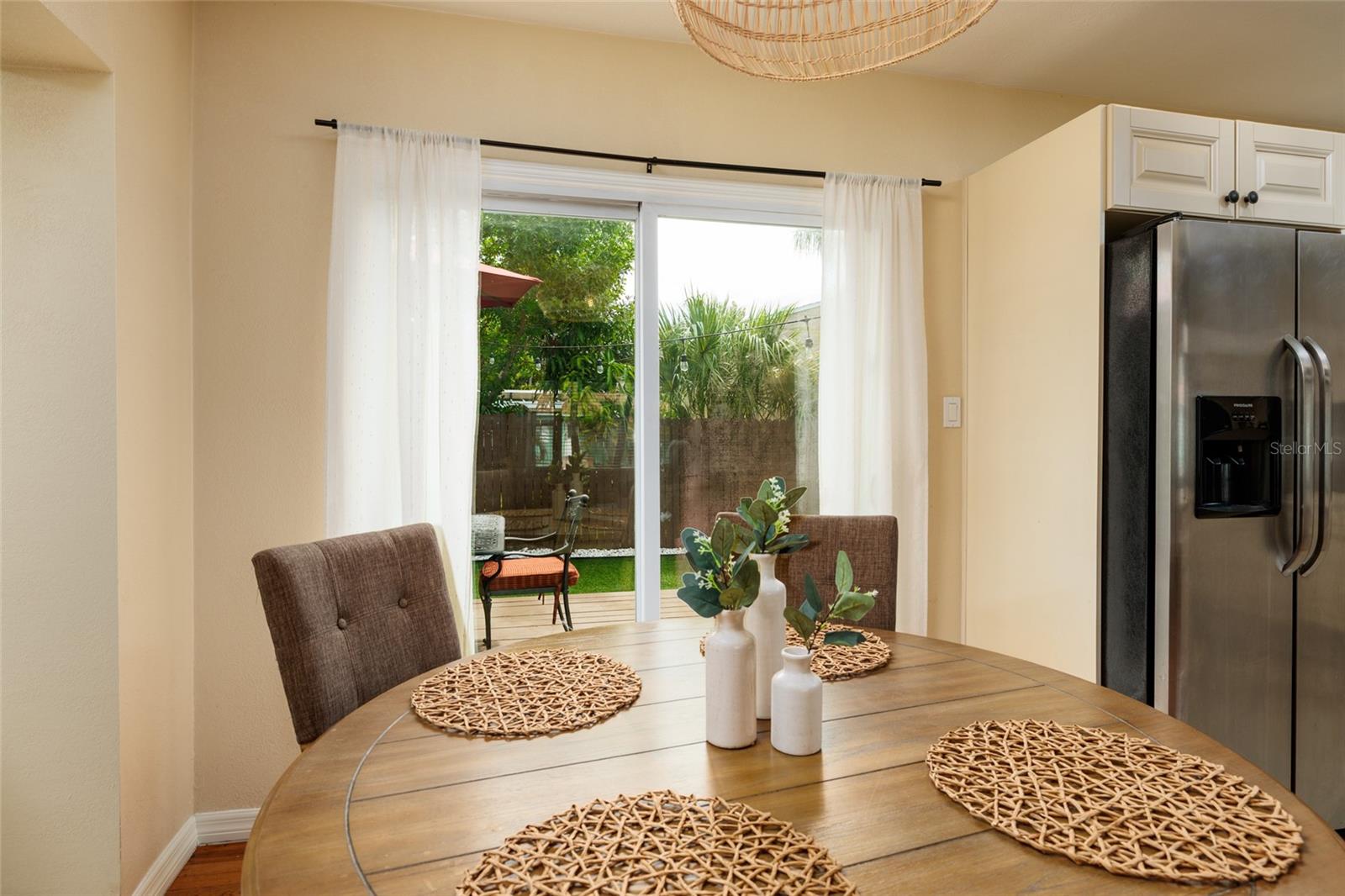 Dining area overlooks lush backyard!