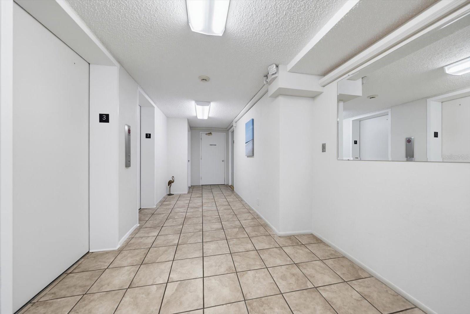 Hallway to Elevators & Laundry Room