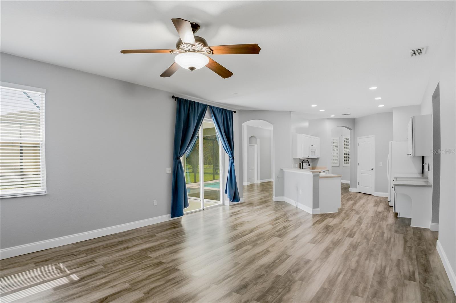 FAMILY ROOM LOOKING BACK INTO KITCHEN AND LIVING ROOM ENTRANCE