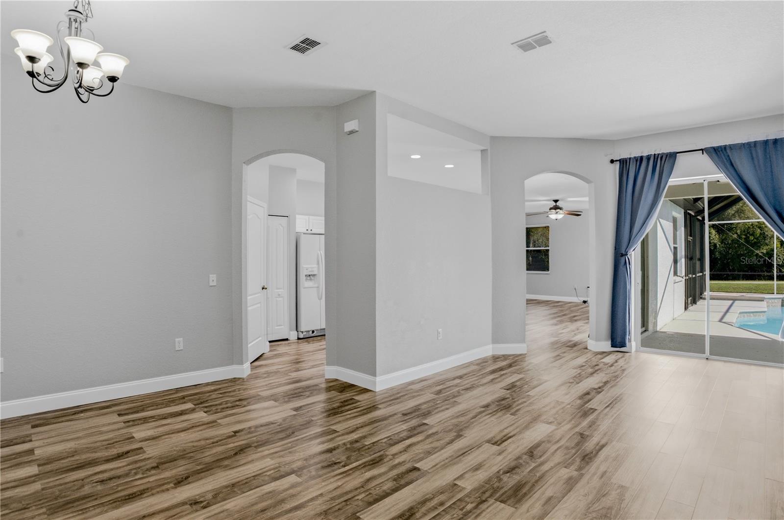 VIEW FROM FOYER-LIVING ROOM TO RIGHT DINING ROOM TO LEFT AND KITCHEN ENTRANCE