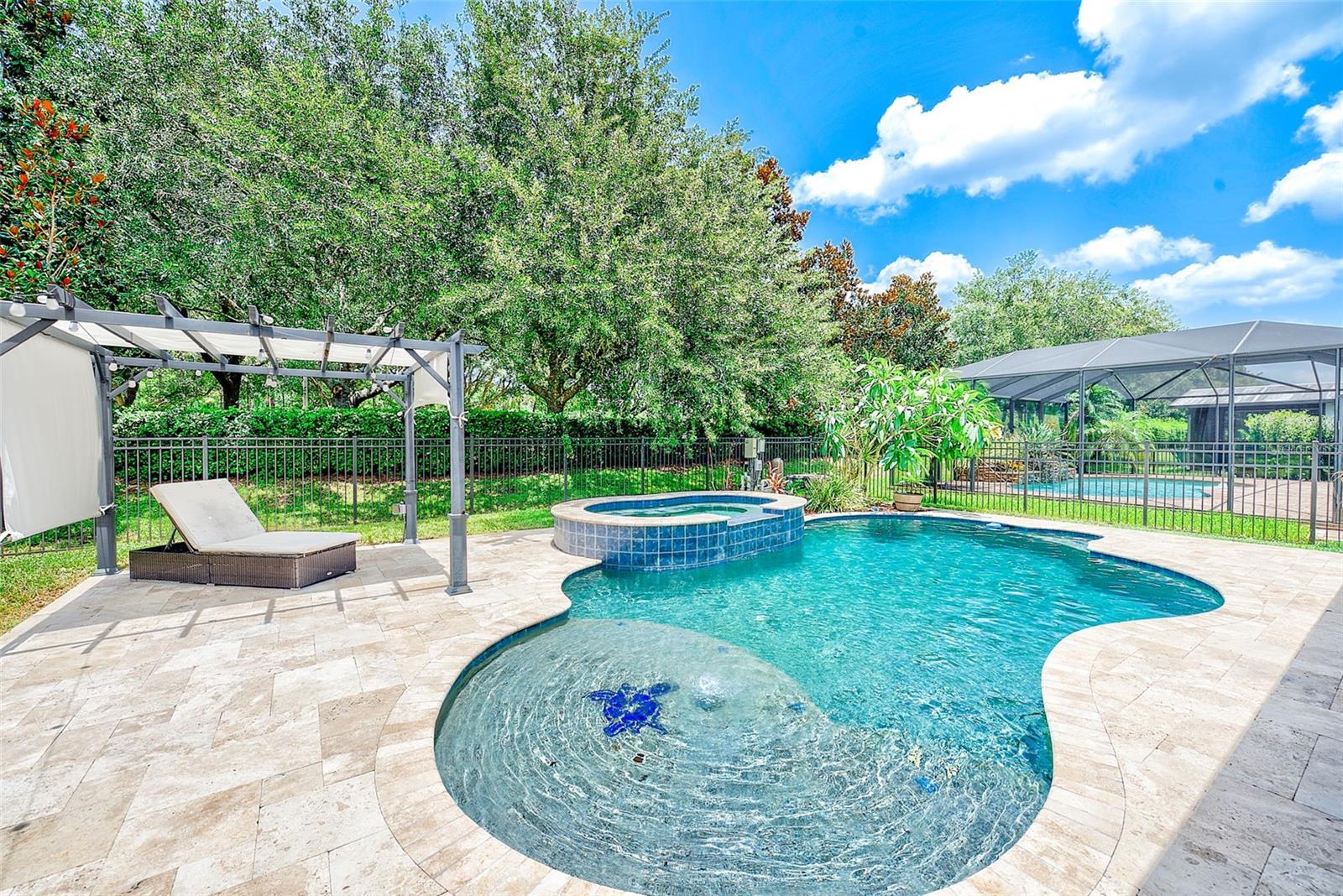 Stunning pool featuring a sunshelf with a umbrella holder and bubbler