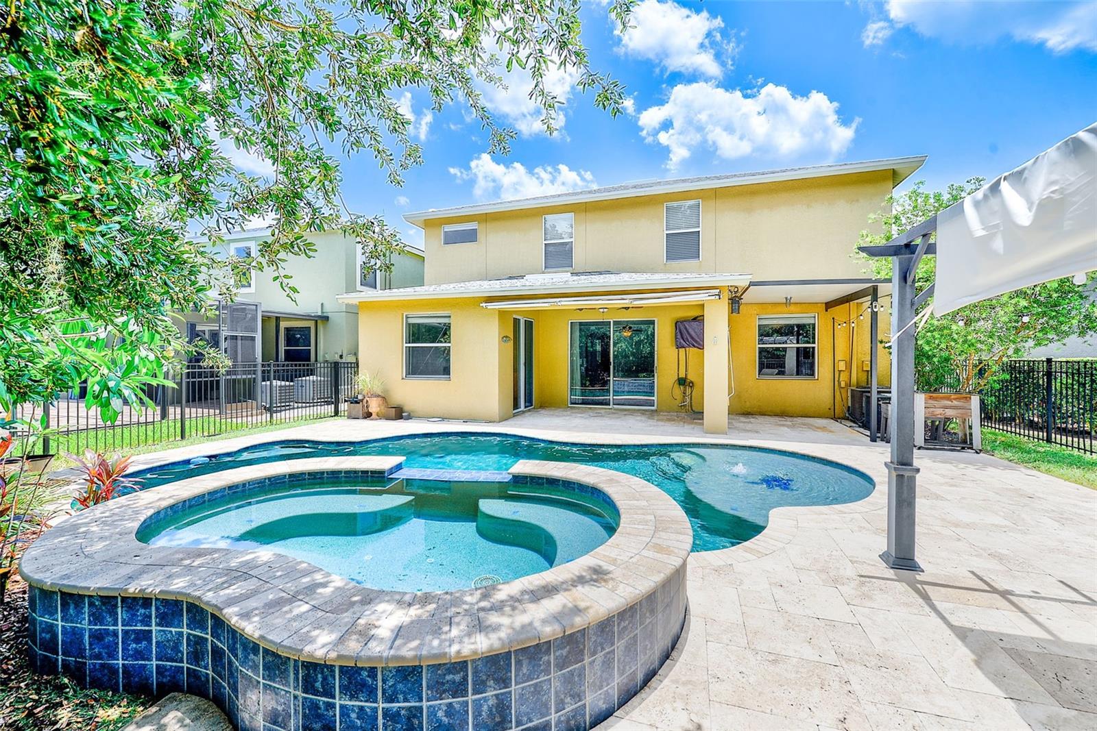 Oversized hot tub featuring power water jets, foot bubbler, water fall spillover and gas heater.