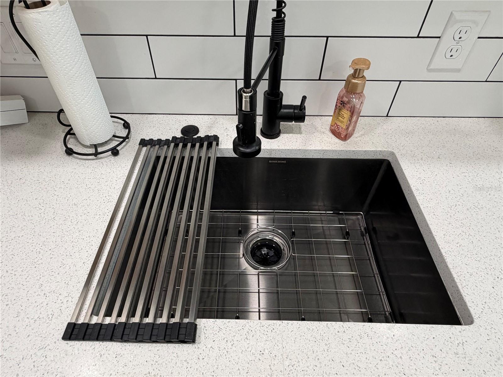 Black stainless sink, with a garbage disposal