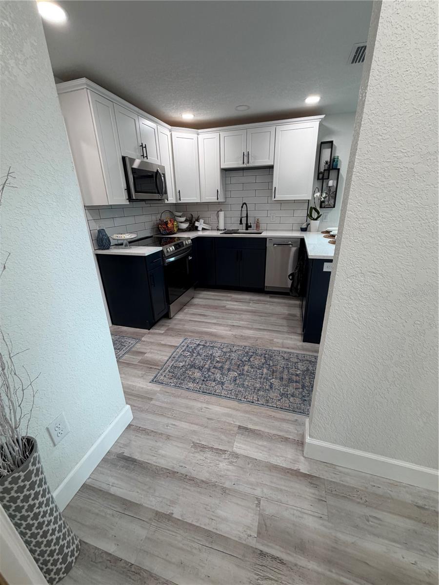 Looking into the kitchen from the hall bathroom