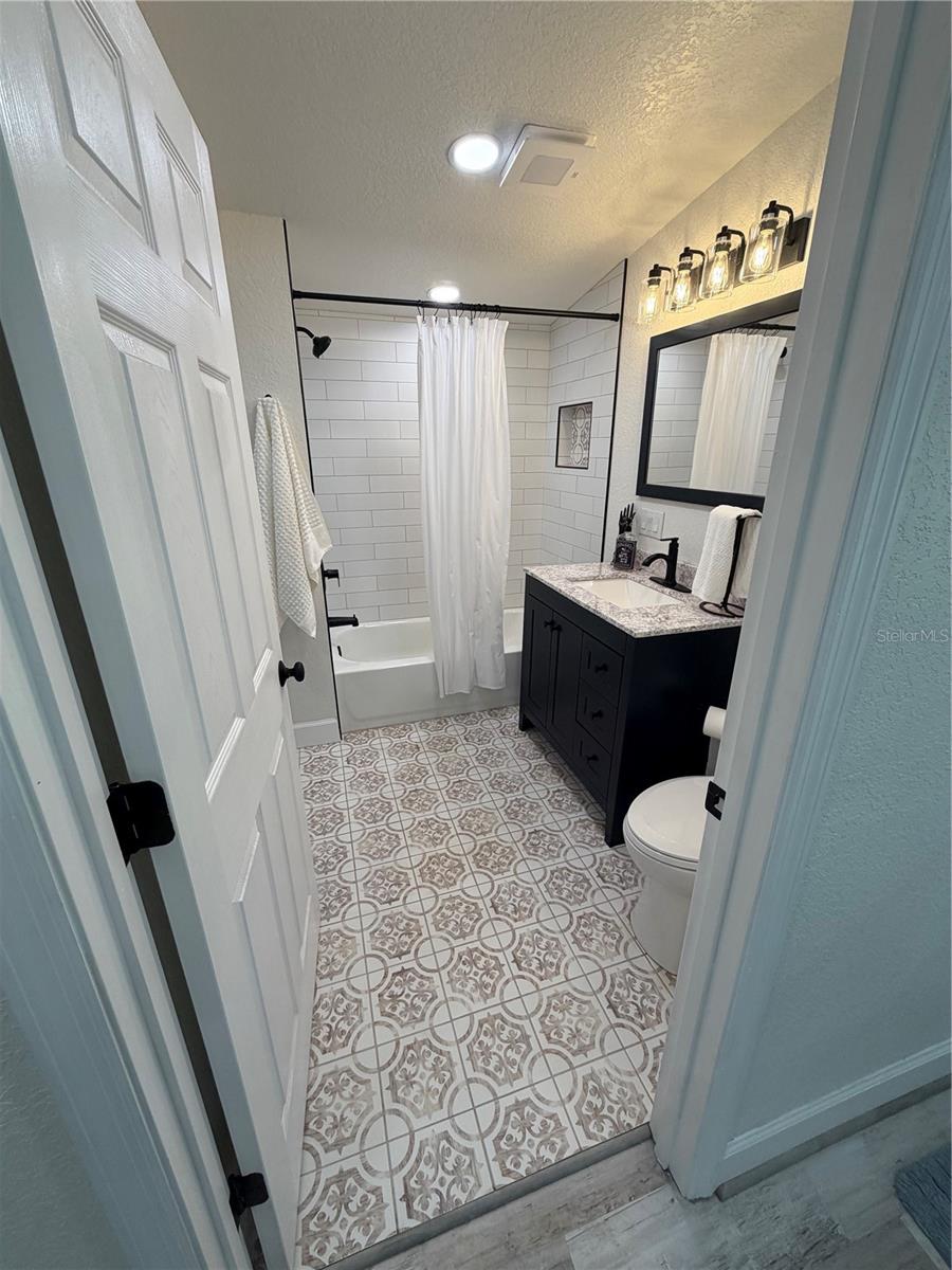 Primary bathroom, completely new… laundry/utility area is to the left across from the bathroom vanity