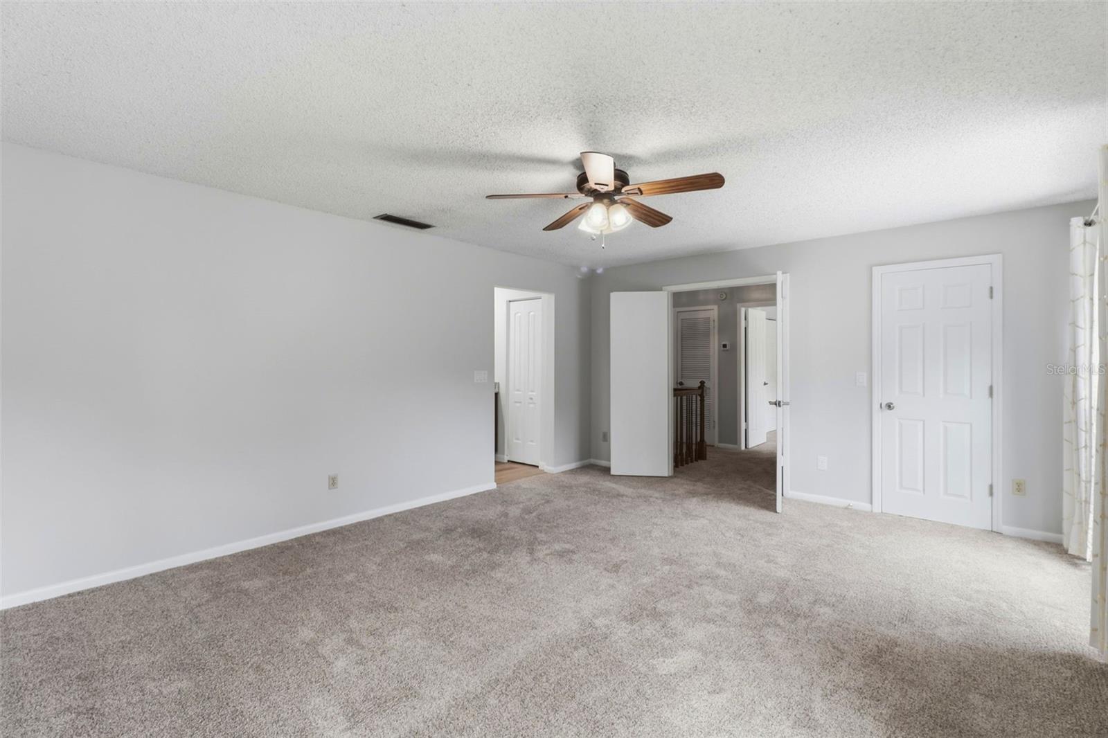 Primary bedroom with double door entry
