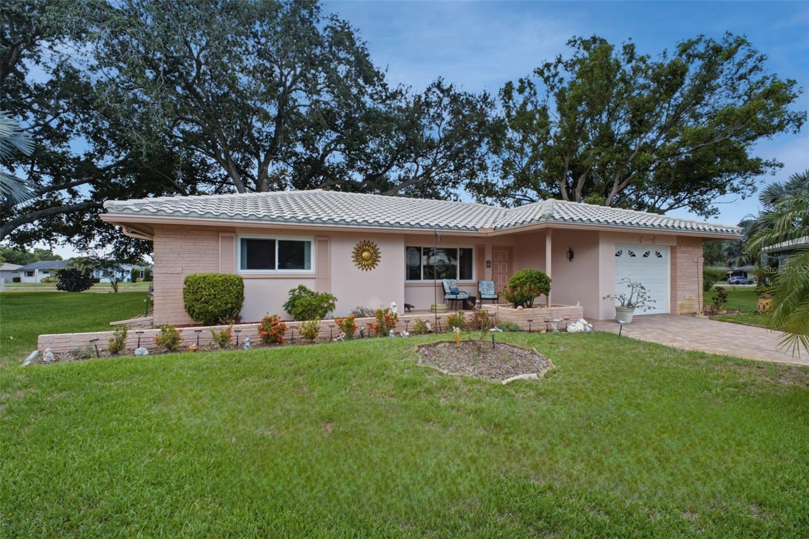 Beautiful paver driveway, concrete tile roof, & hurricane-impact windows~