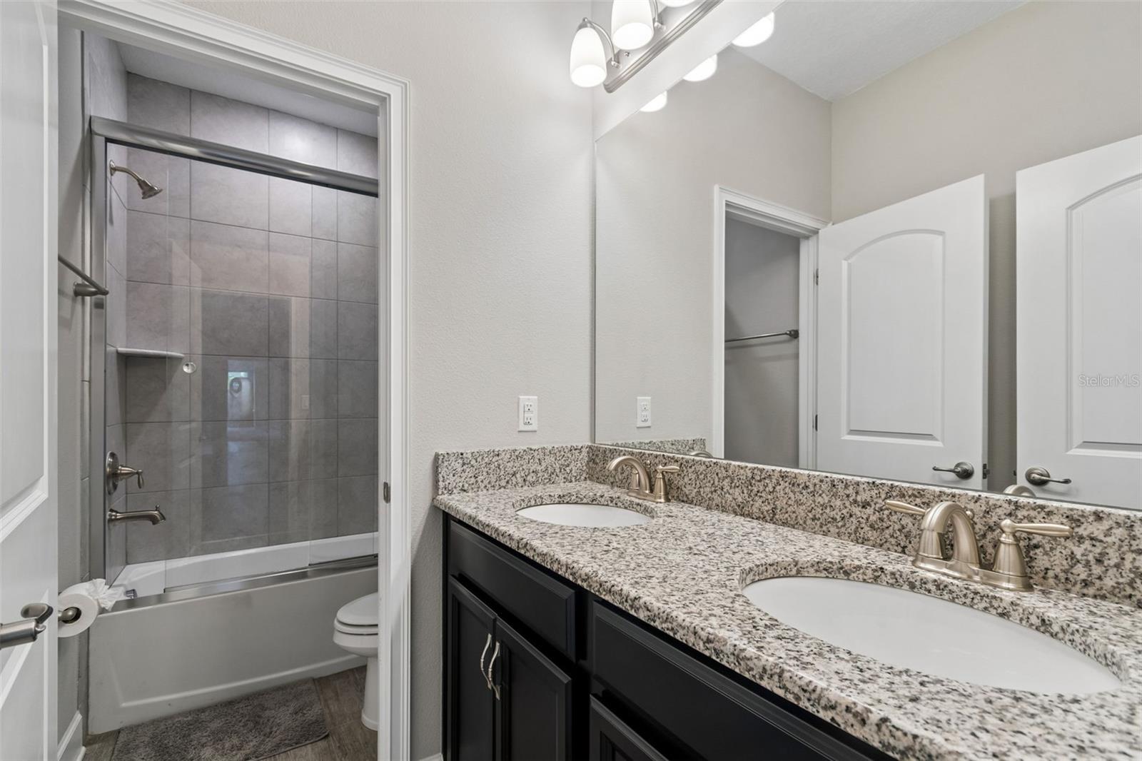 Upstairs bathroom with dual sinks