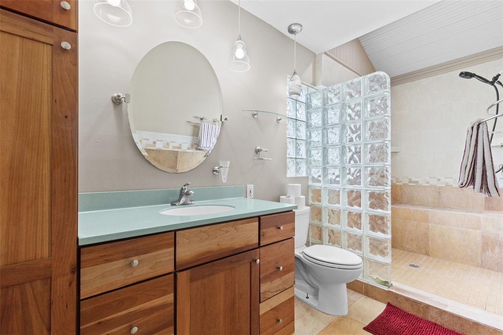 Note the roomy built-ins in the premium bathroom with double shower