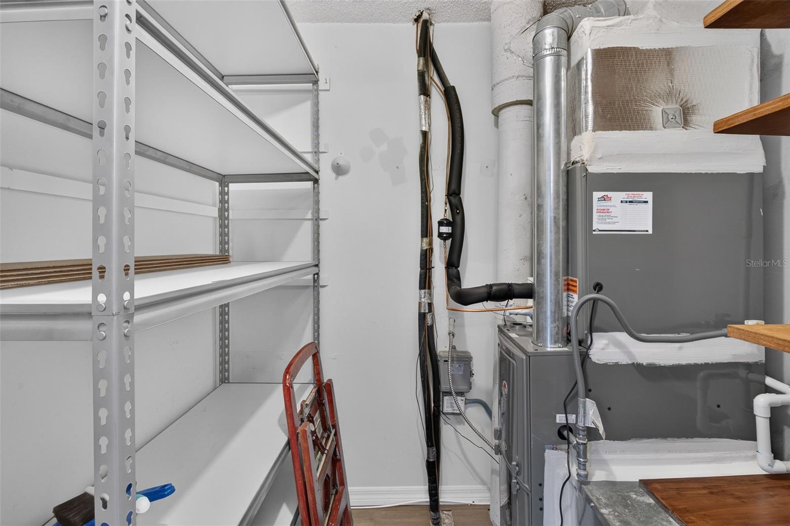 Storage in unit with shelves.