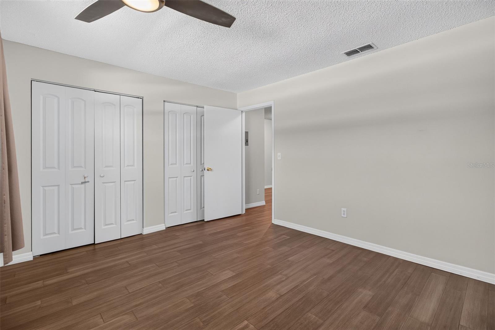 Bedroom with large built in closets.