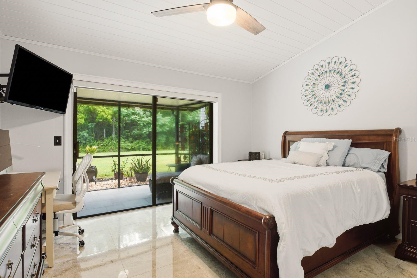 primary bedroom features sliders to patio