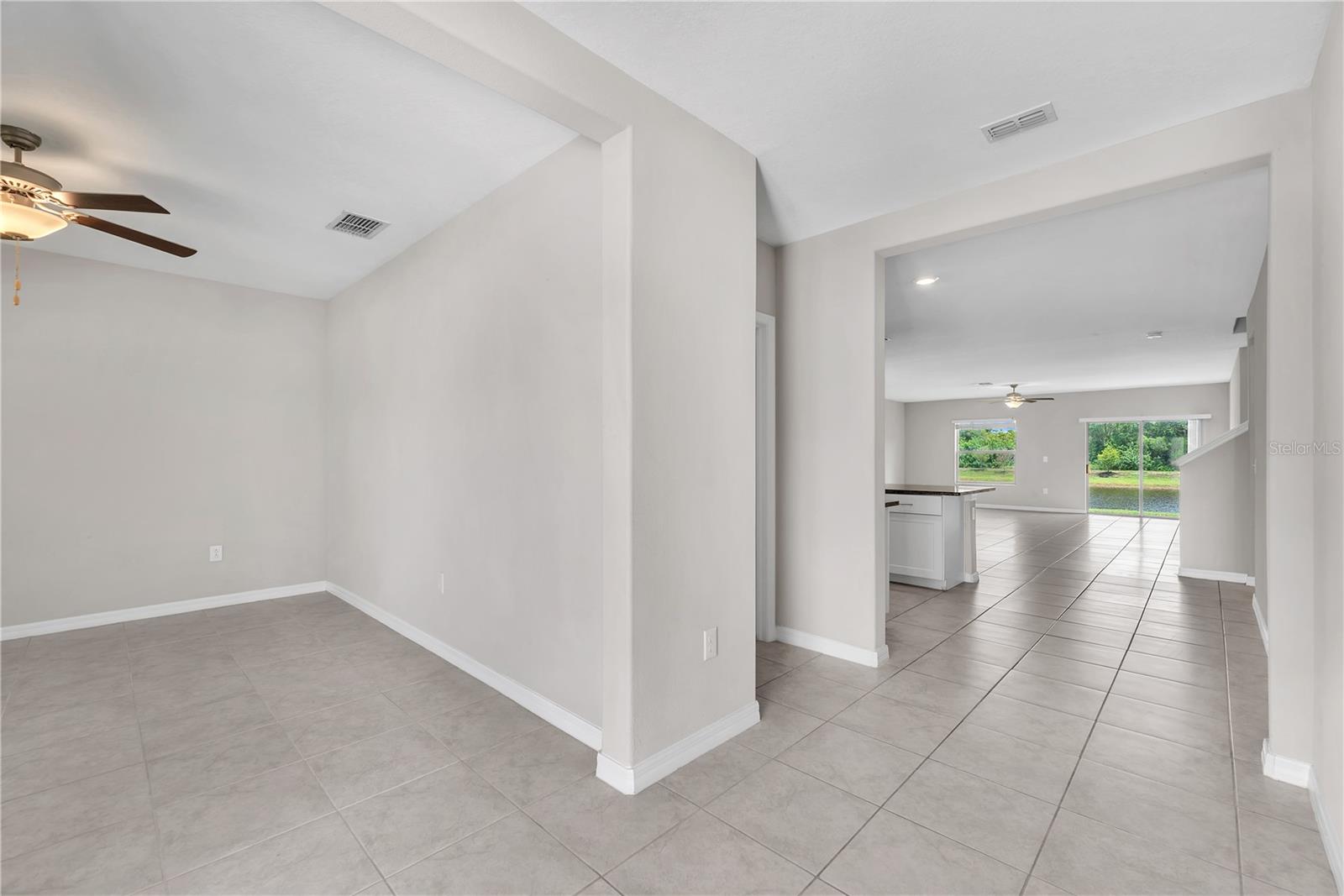 Just inside the front door is a flexible room providing endless possibilities as a home office, playroom, fitness area, or hobby space to suit your lifestyle.