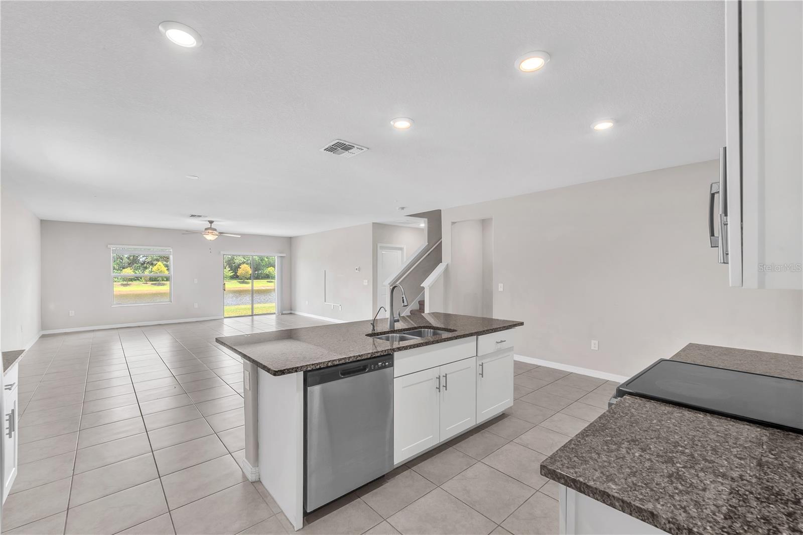 The kitchen, dining, and living room seamlessly flow together, creating the ideal gathering place for everyday living and special occasions.