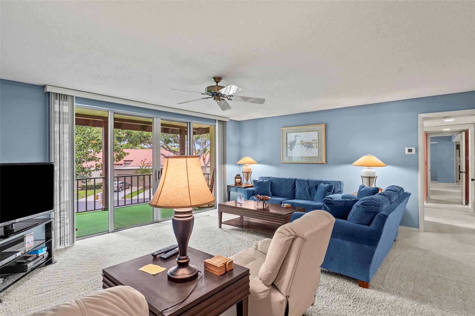 Spacious Livingroom with glass sliders to lanai