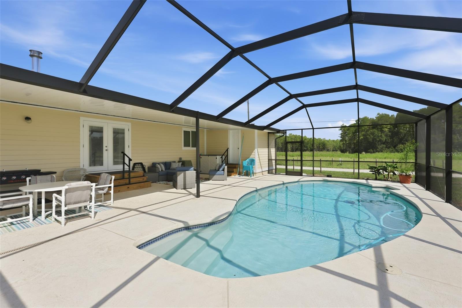 Plastic table set by pool conveys