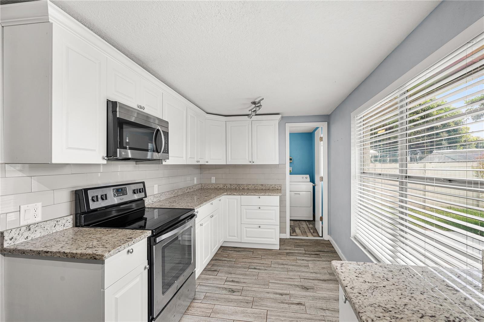 Kitchen with Granite Countertops and Stainless Steel Appliances