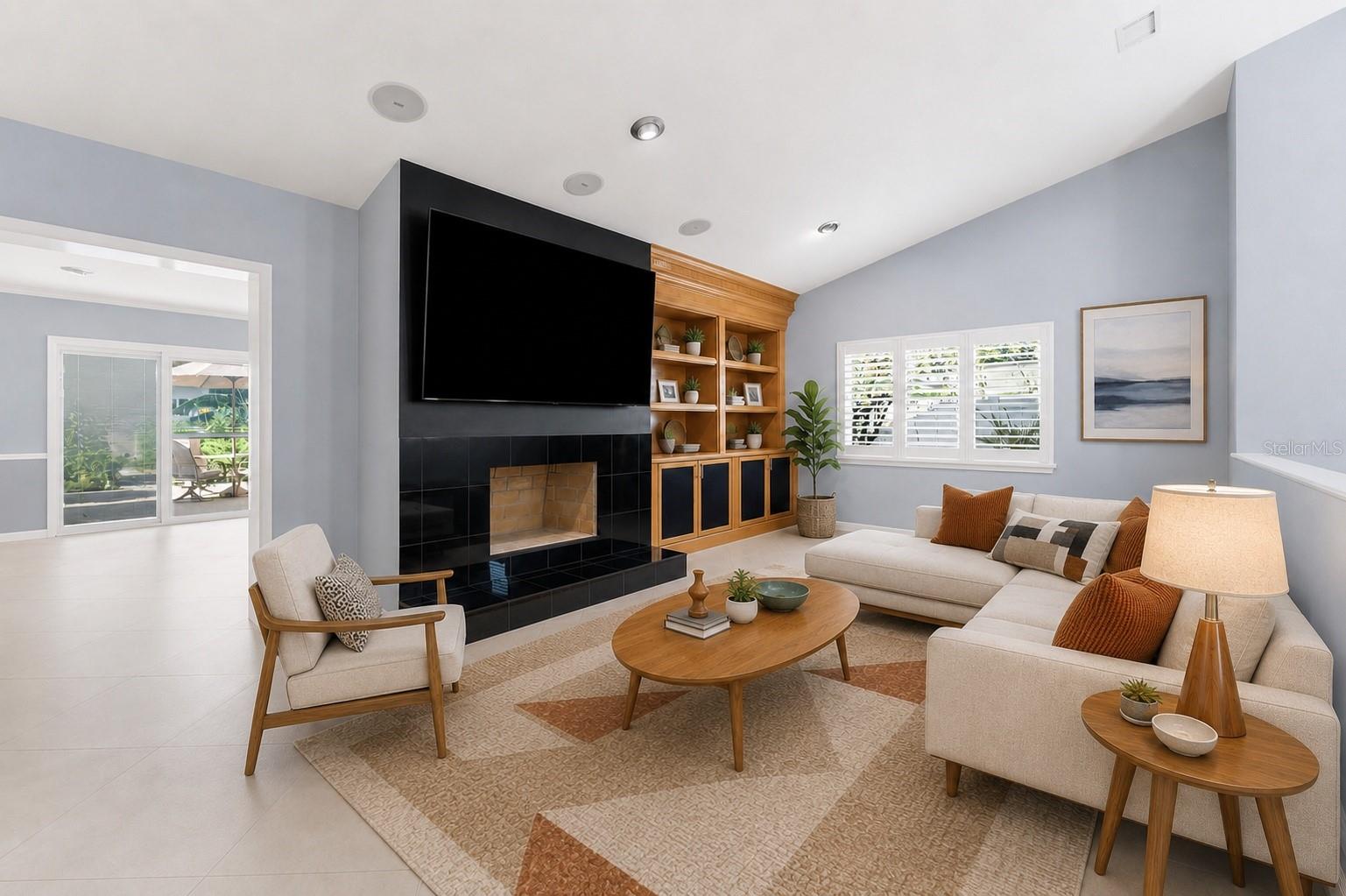 family room with fireplace and built in shelves