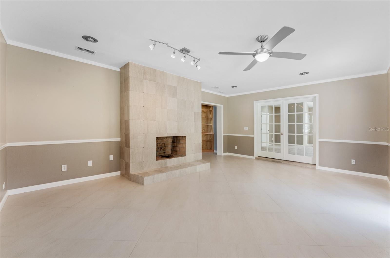 formal living room or dining room with french doors to bonus space