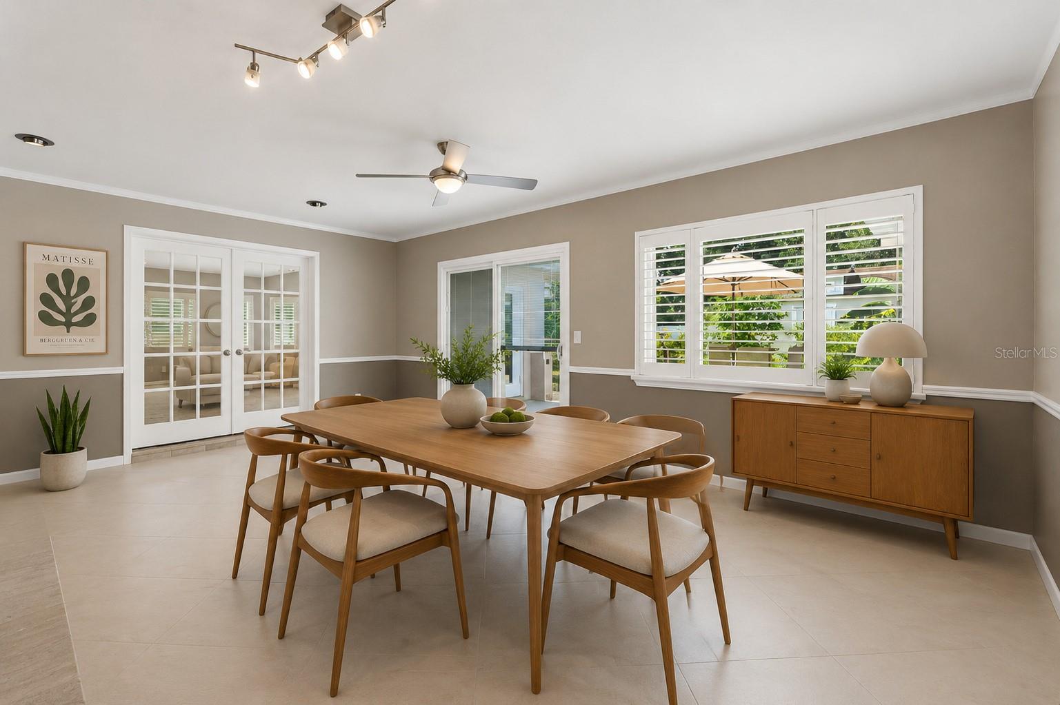 formal living room or dining room with sliders to back yard and french doors to bonus space