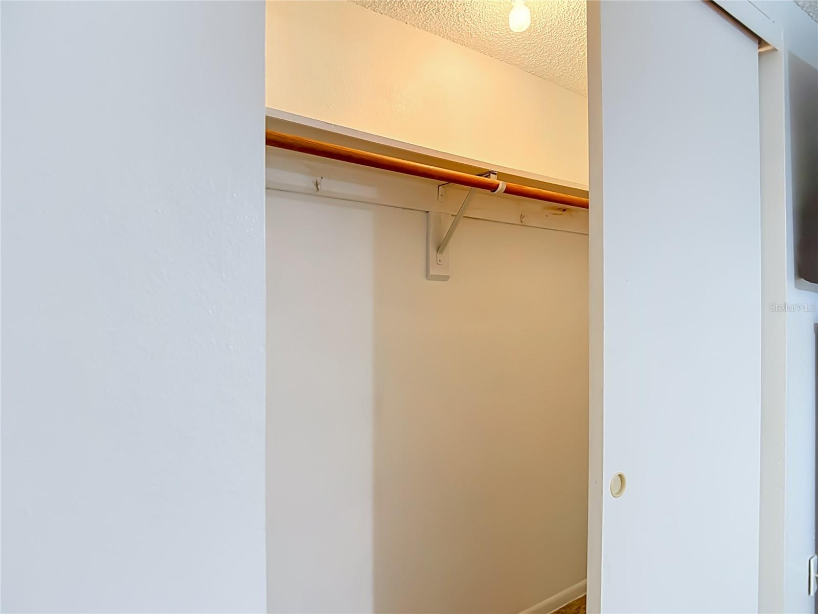 primary bedroom with a built in closet