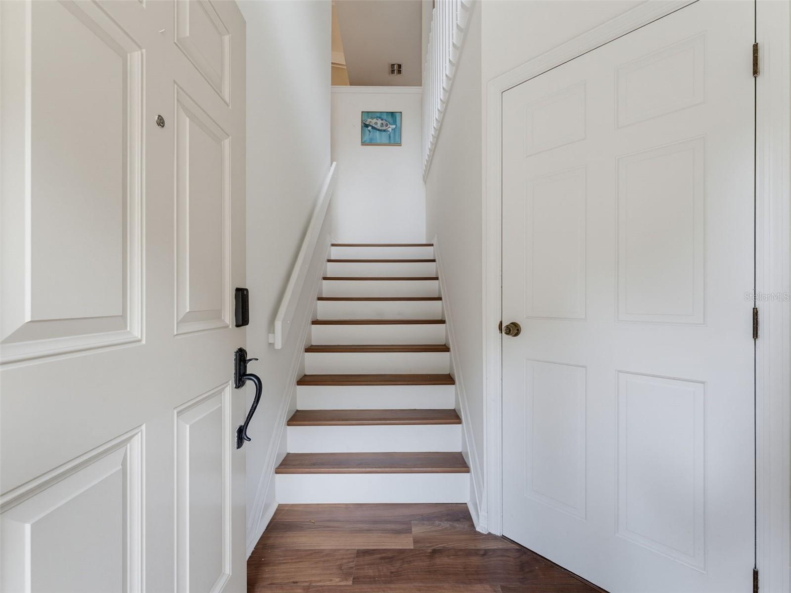 Foyer leading to living area and garage