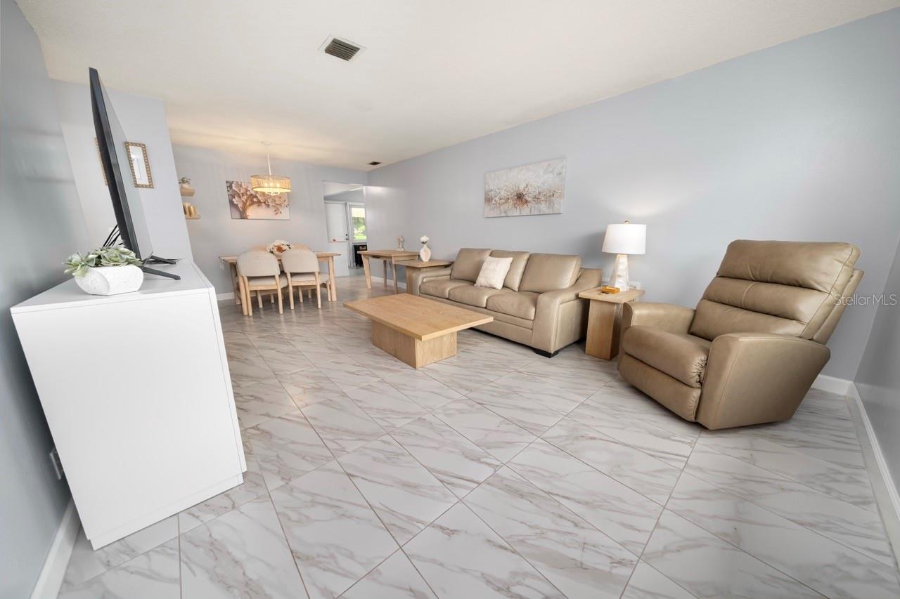 FAMILY ROOM. THIS VILLA STYLE CONDO IS PERFECT FOR ENTERTAINING FAMILY AND FRIENDS
