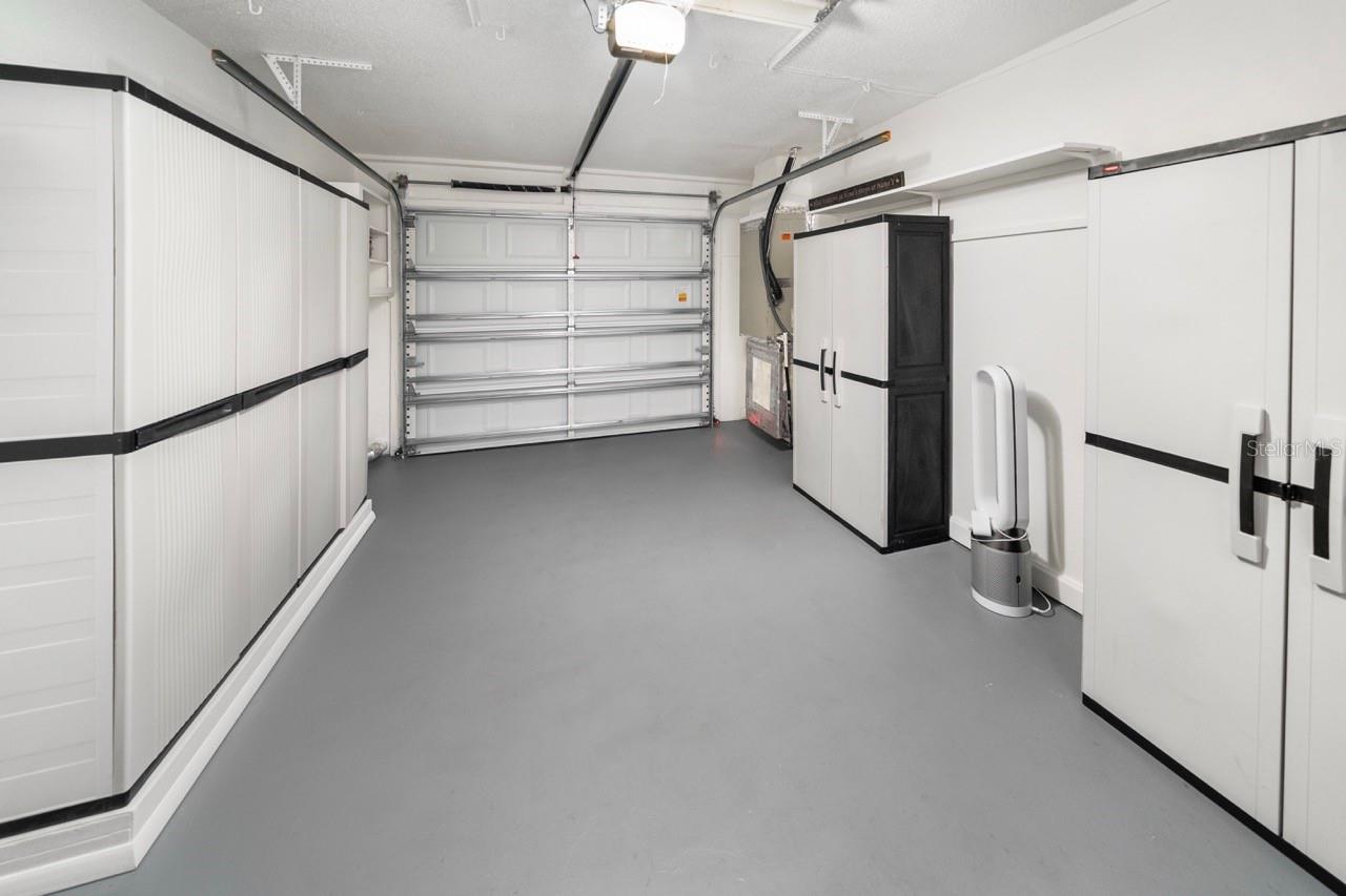 GARAGE. LOTS OF STORAGE. STILL MORE THAN ENOUGH ROOM FOR YOU CAR, SUV, OR TRUCK.