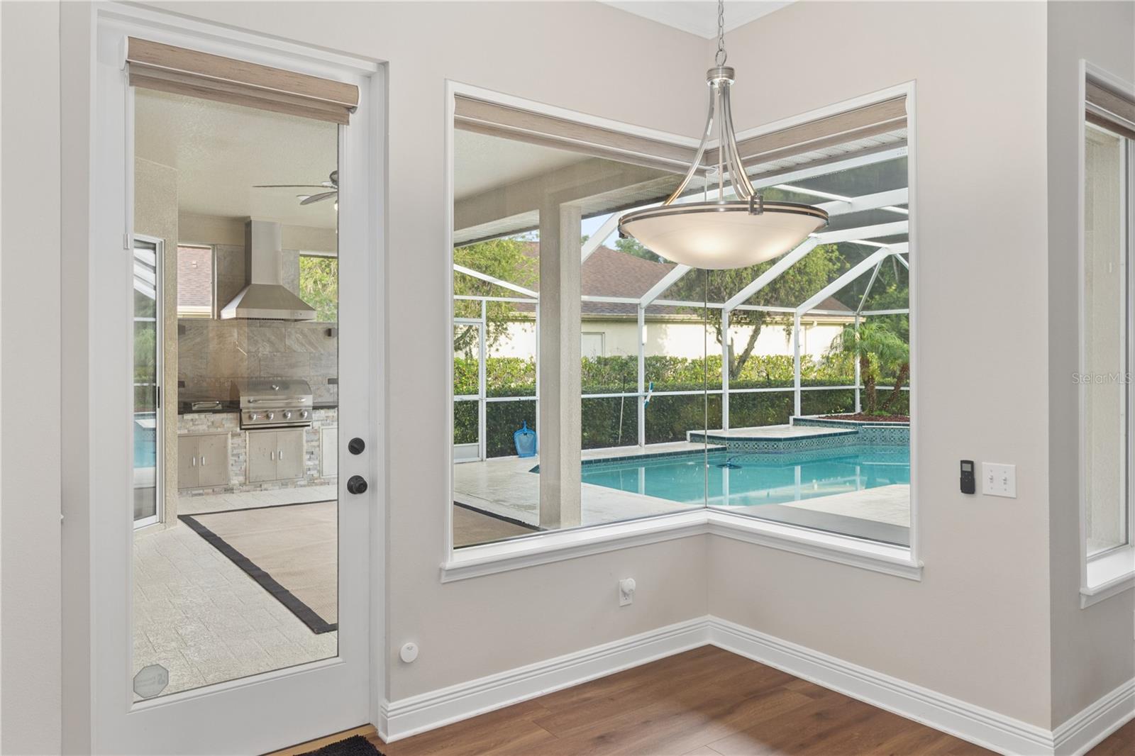 Enjoy casual dining in the bright breakfast area, complete with pool views and direct access to the screened lanai.