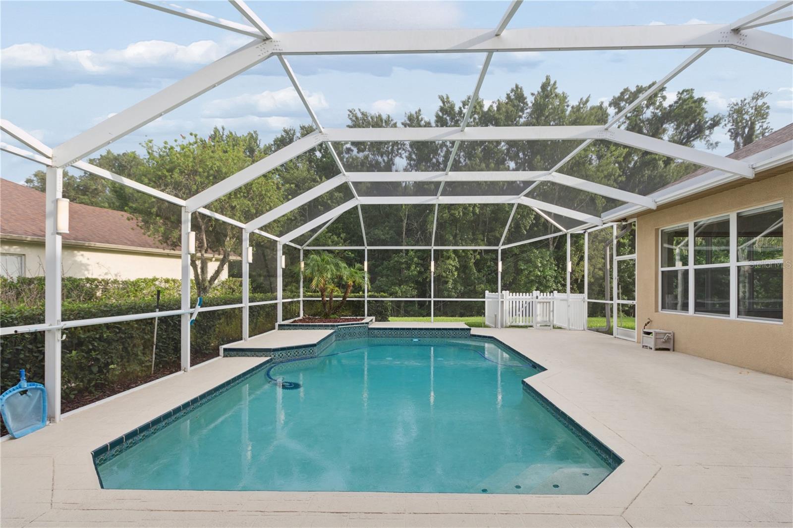 Pet lovers will appreciate the dedicated dog run, complete with a built-in doggie door that provides convenient access to a private outdoor area.