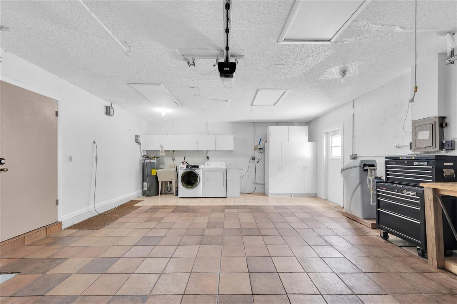 Two car garage with washer and dryer