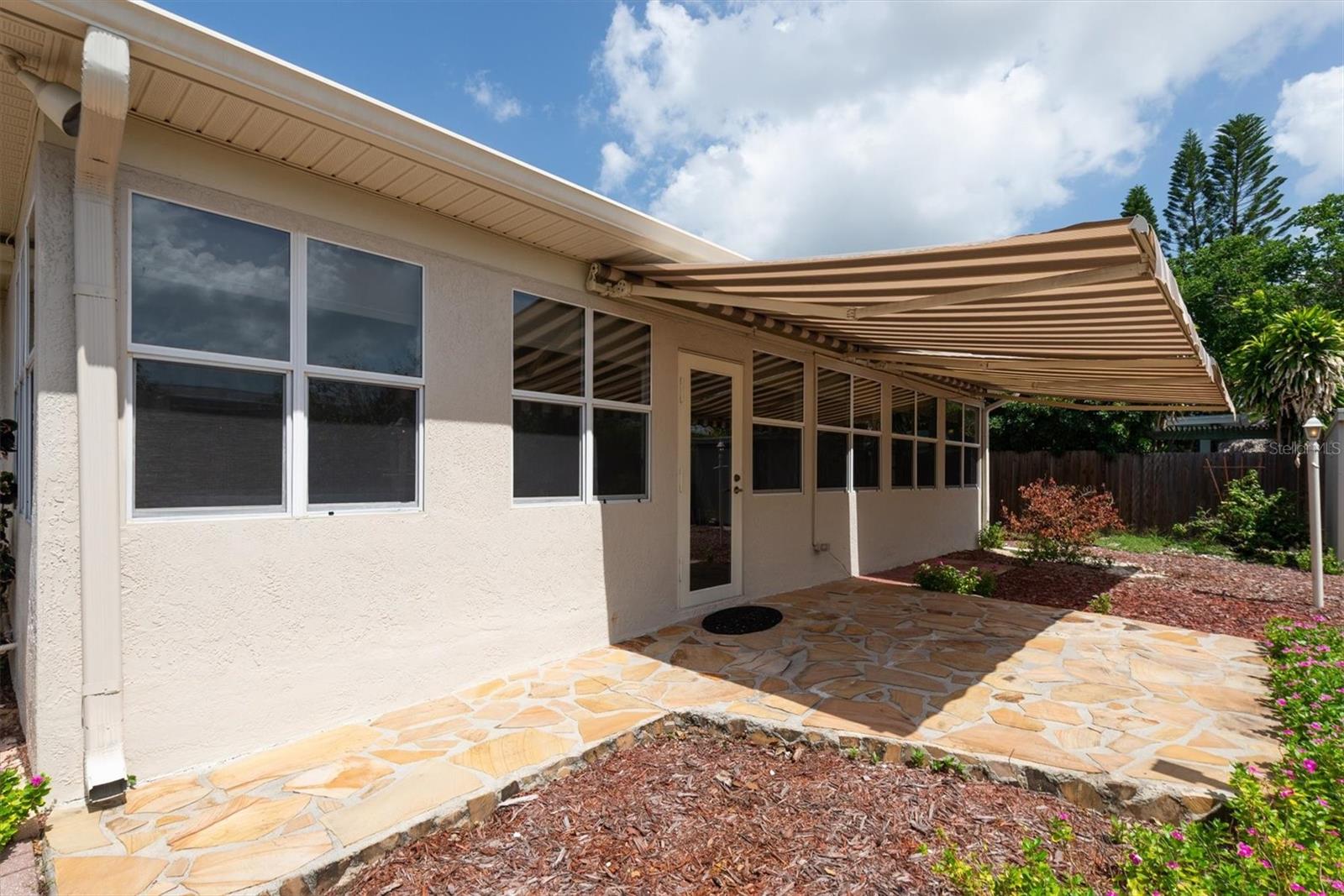 Back Patio with remote controlled Sun Shade Awnings
