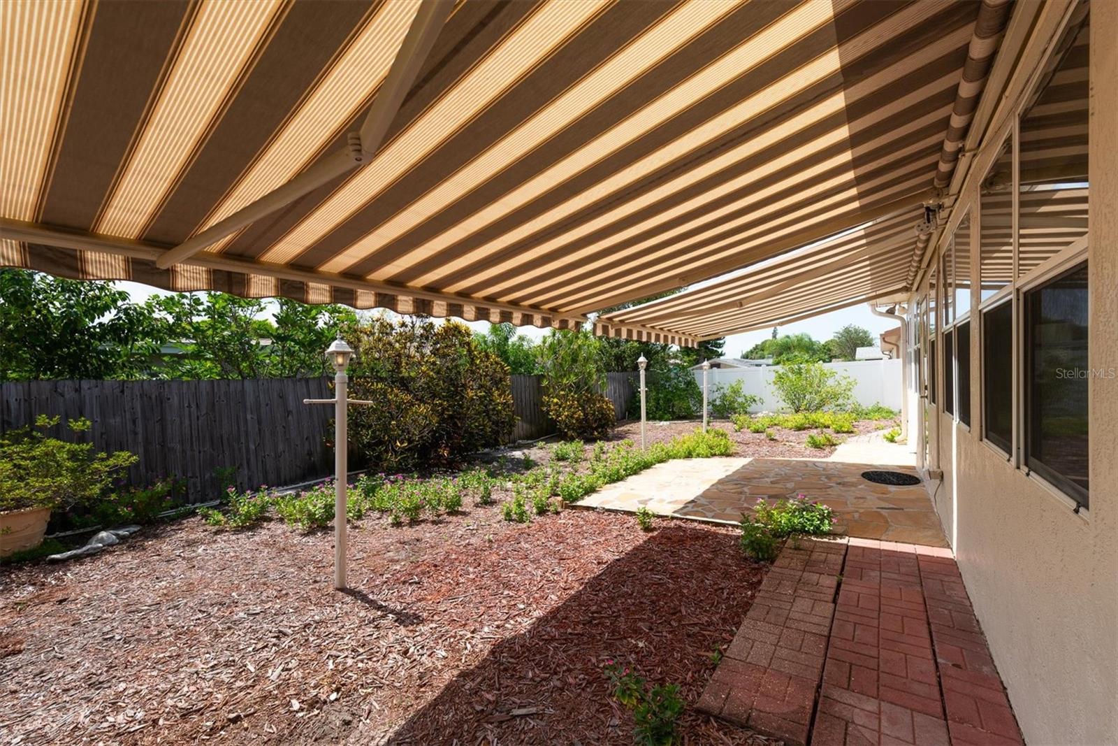 Back Patio with remote controlled Sun Shade Awnings - great for entertaining