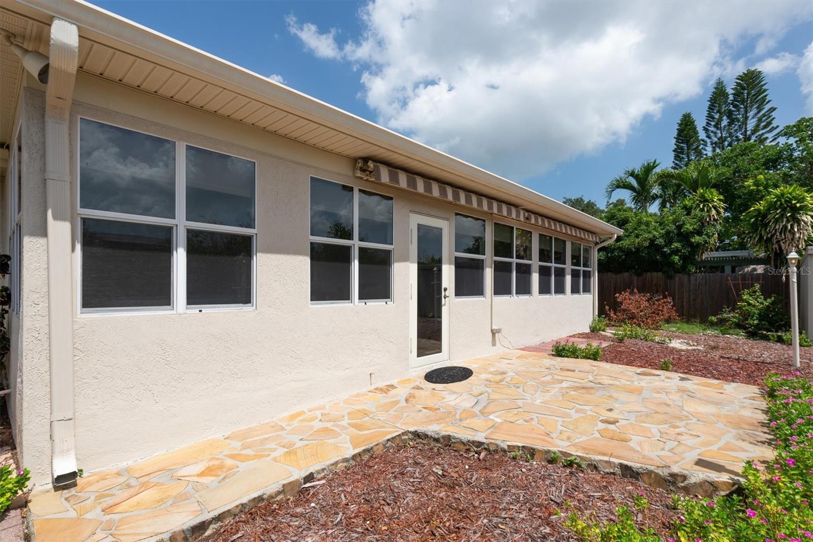 Back Stone Patio with remote controlled Sun Shade Awnings Retracted
