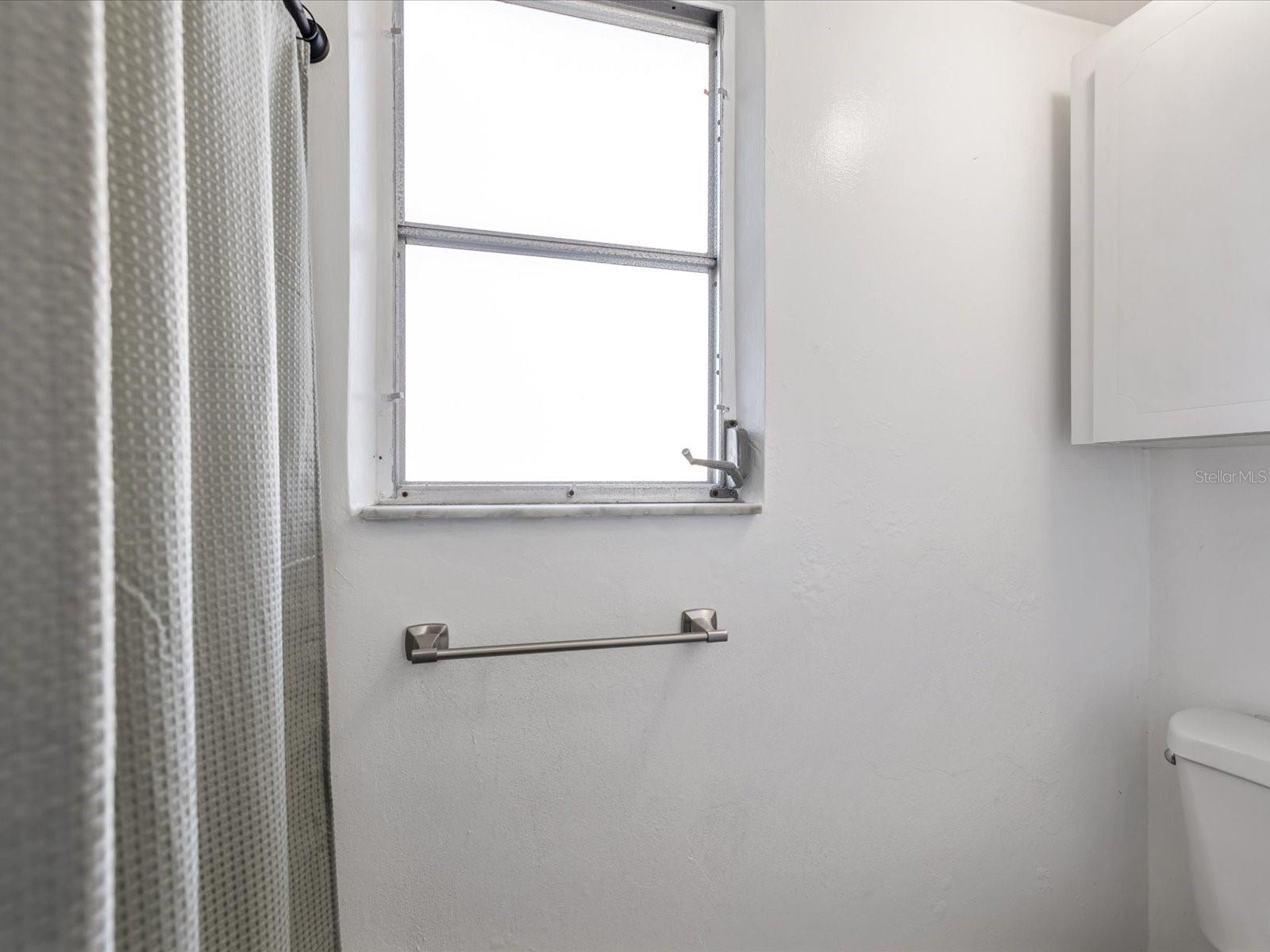 Secondary bathroom with fully remodeled shower