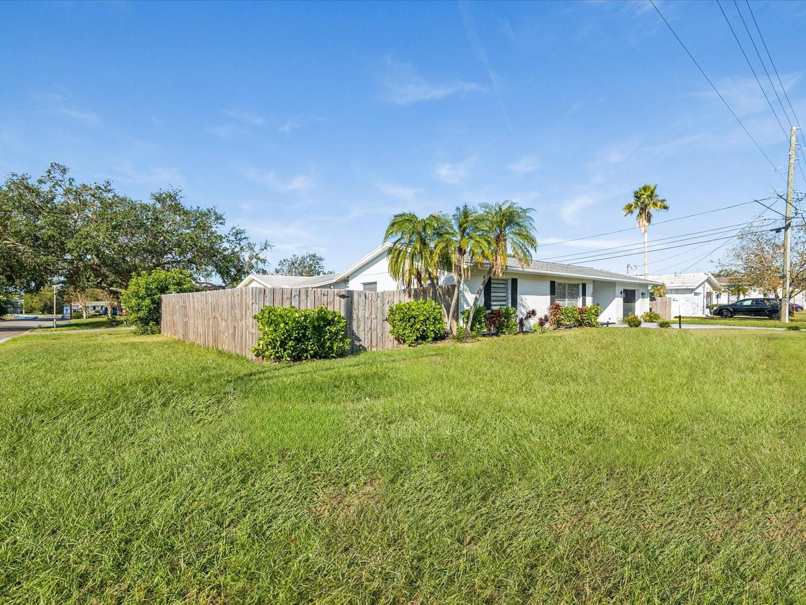 Large corner lot with fenced backyard.