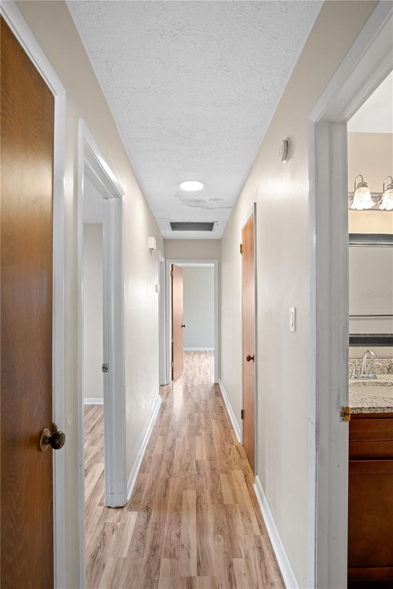 Hallway leading to bedrooms and bathrooms