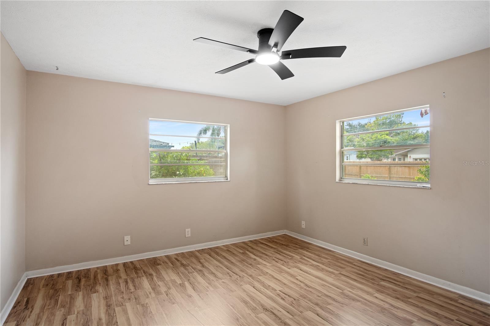 Primary bedroom with views of the backyard
