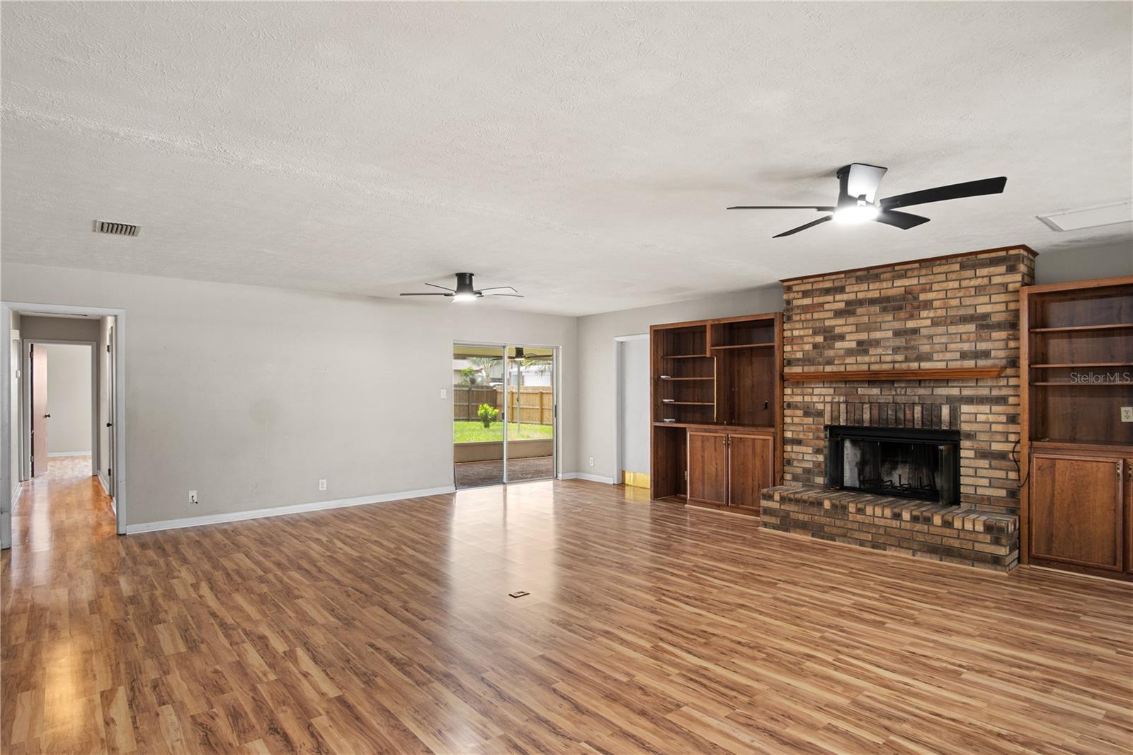 Gorgeous brick fireplace is the center focus of the living room