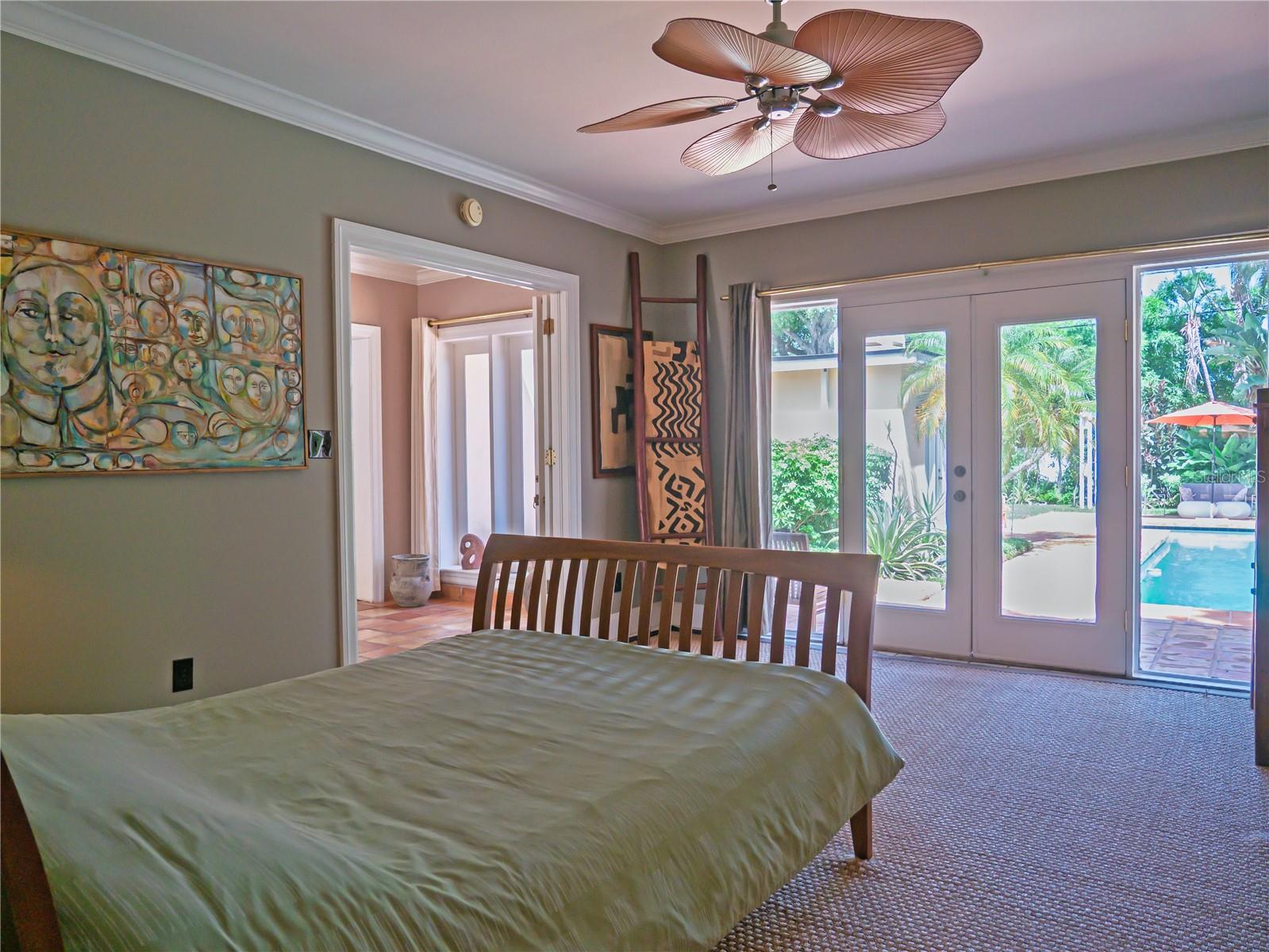 Primary Bedroom with view of Pool