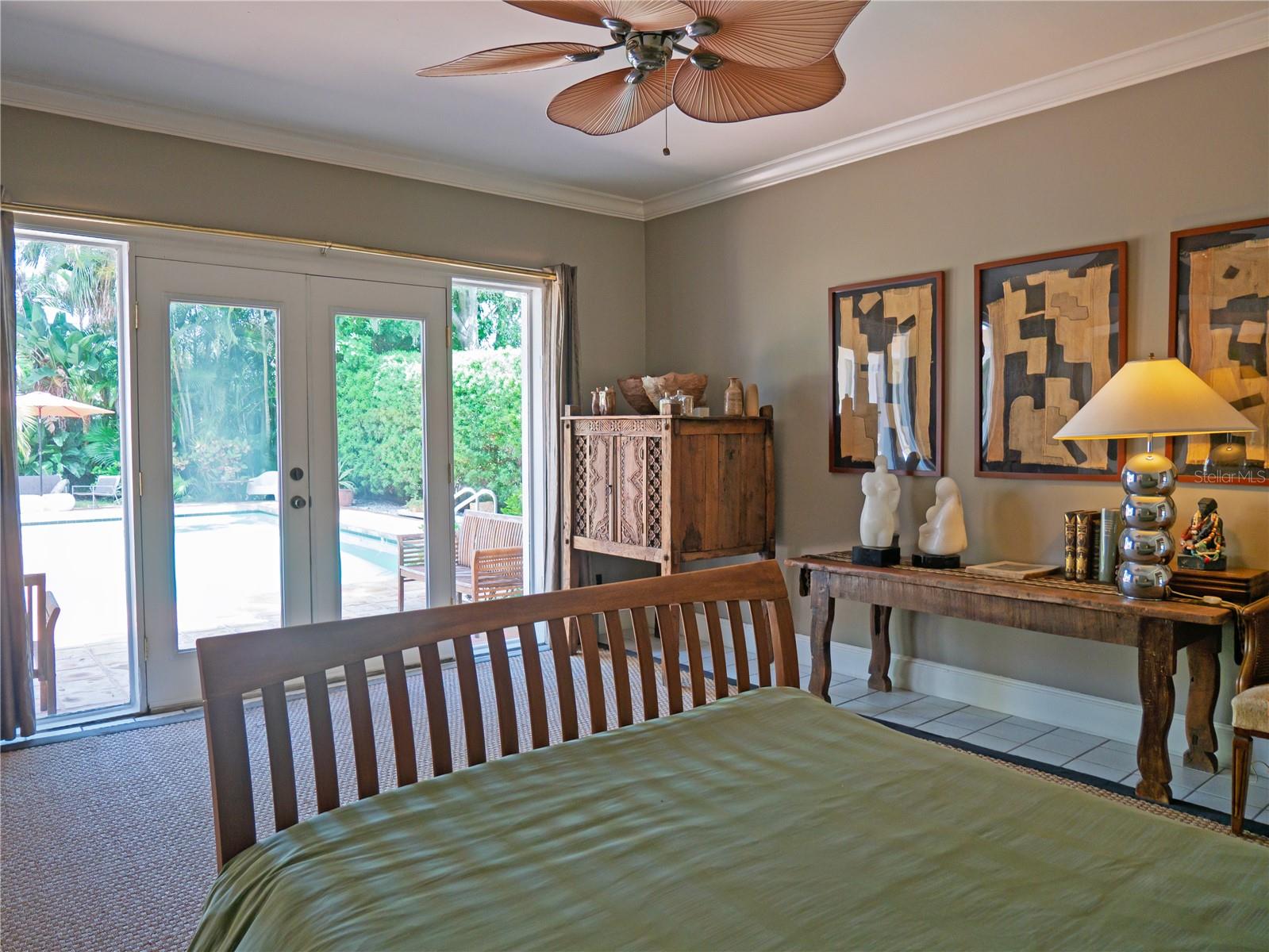 Primary Bedroom with view of Pool
