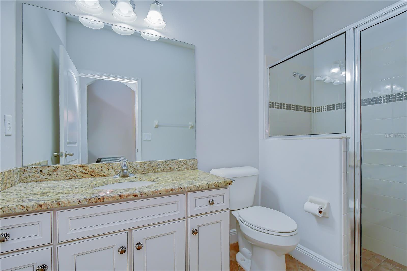 Additional full bathroom for guests.