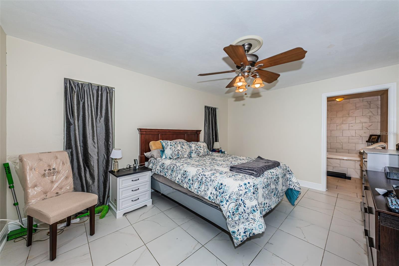 Primary bedroom with large bathroom and walk in closet