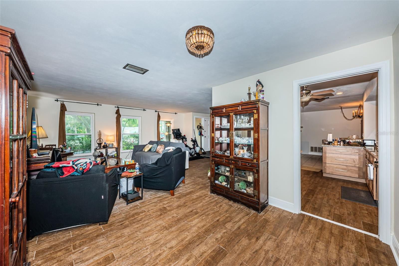 L-shaped living room with what was the dining space