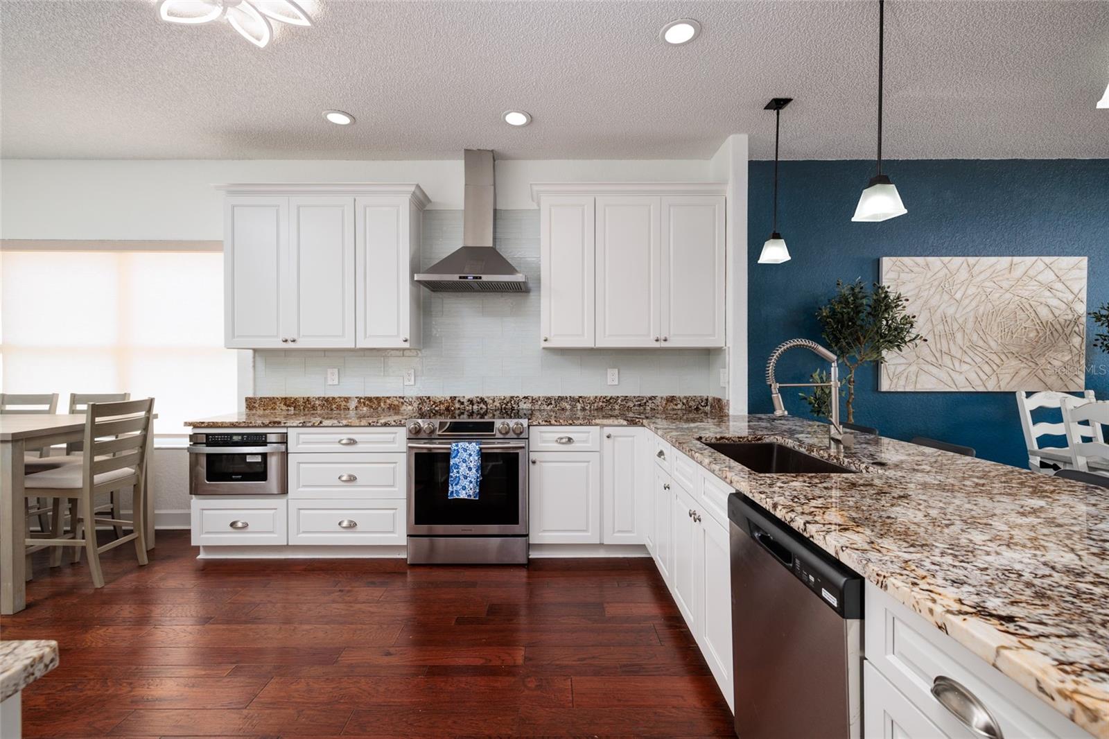 Kitchen with stainless steel appliances, and an eat in kitchen area.