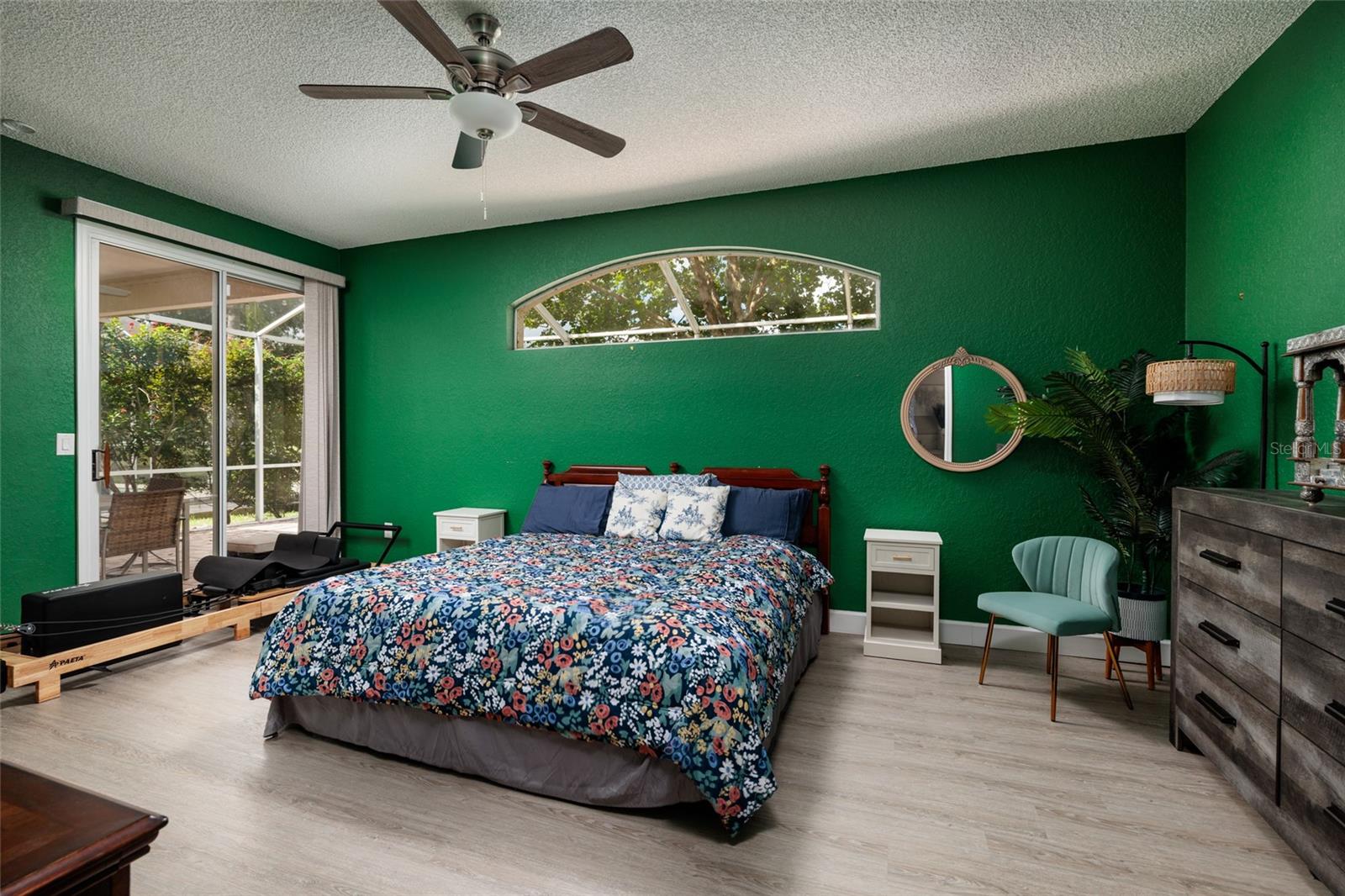Primary bedroom with sliders to the lanai.