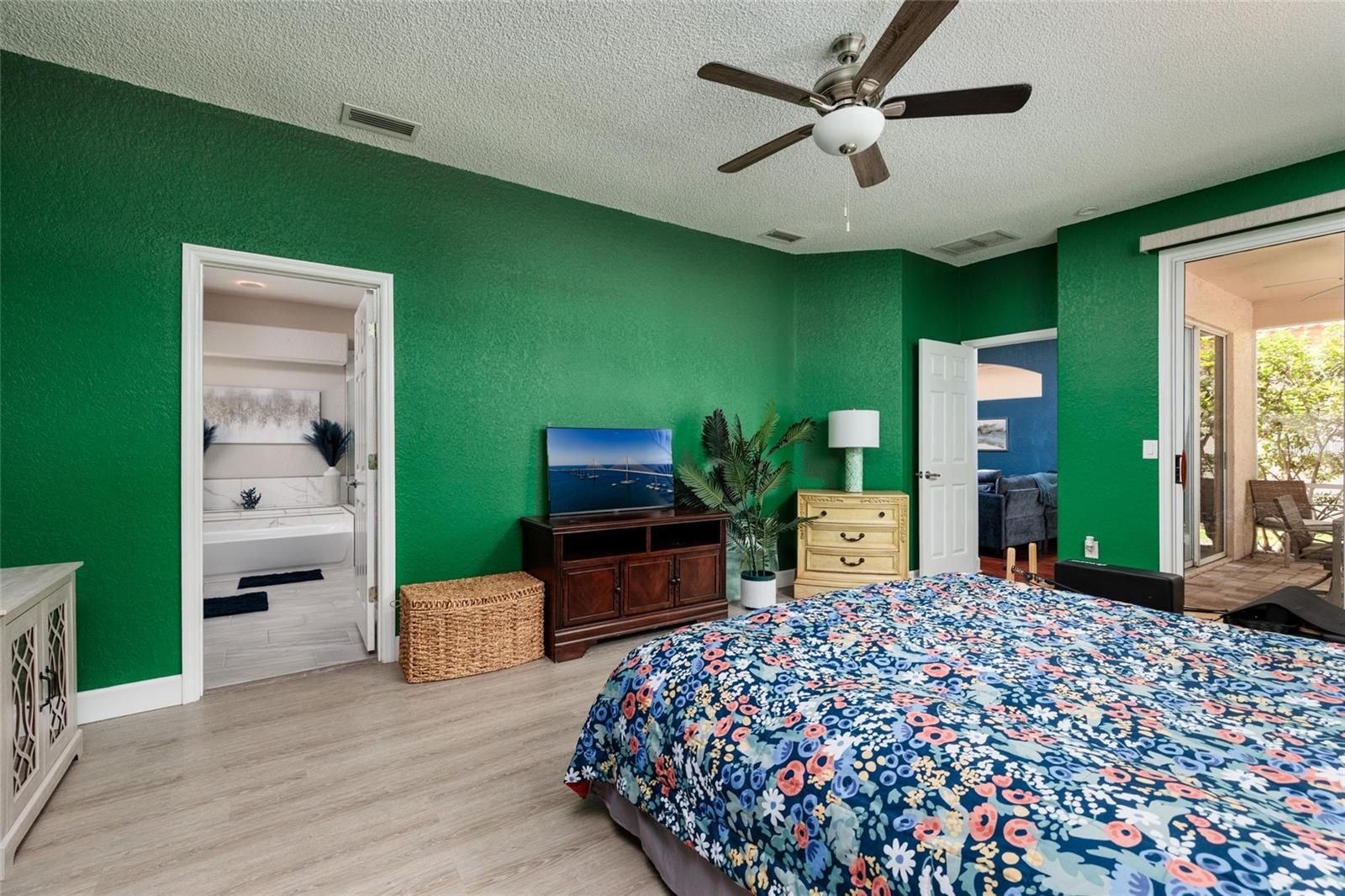 Primary bedroom leading into bathroom and walk in closet.