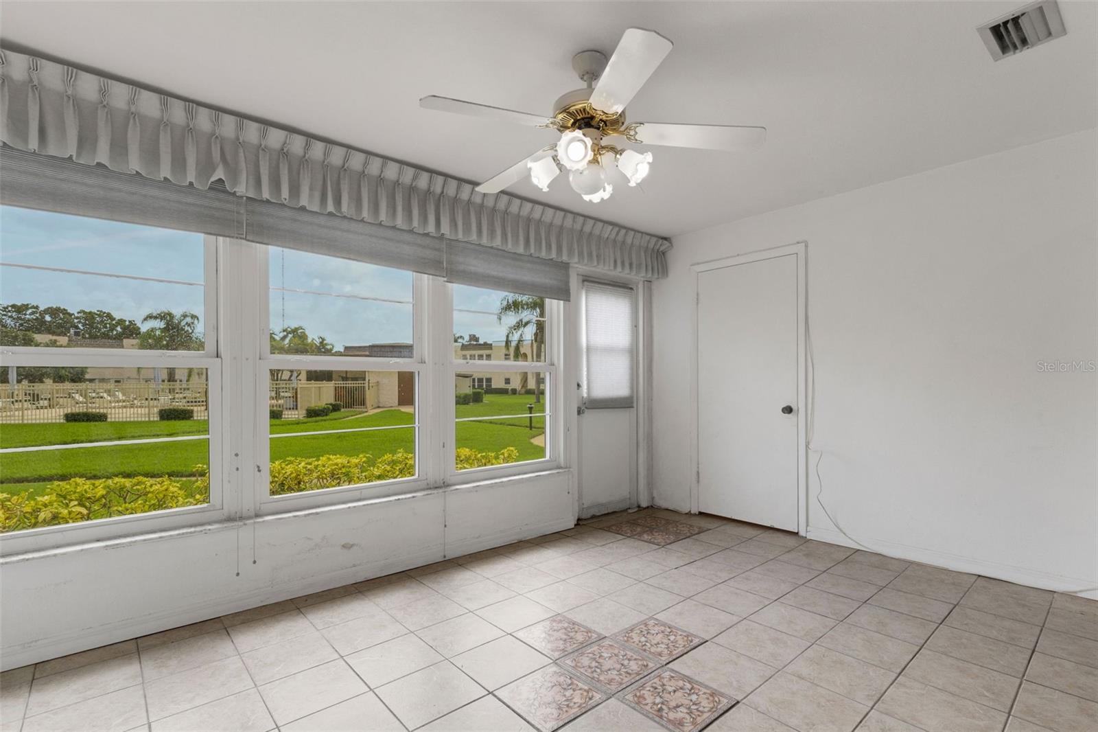 Florida Room. The Door on Right is a Storage Closet.